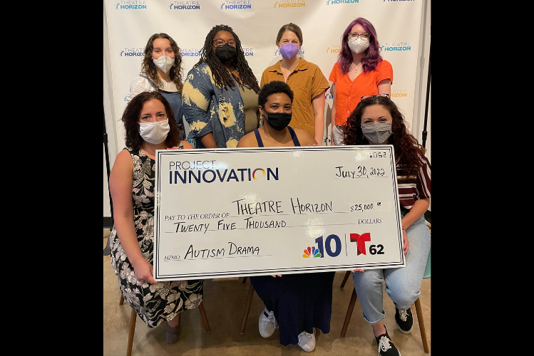 Theatre Horizon staff and teaching artists hold an oversized check from Project Innovation